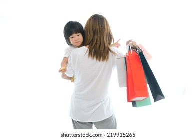 Asian Morther Holding Baby And Shopping Bags White Background Isolated