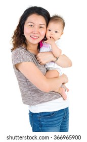 Asian Mother And Baby Indoor Portrait