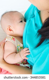 Asian Mother Breastfeeding Her Three Months Old Baby