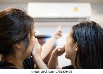 Asian Mother And Daughter Are Closing Her Nose, Bad Smell,musty Smell Of Air Conditioner Has A Problems,dust And Dirt Coming In Through The Air Ventilation,concept For Checking Air Conditioner At Home