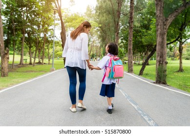 Asian mother and daughter student walking to school.Pupil student.