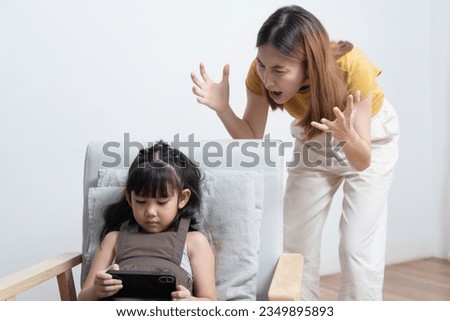 Asian mother feeling stress her daughter game addiction.