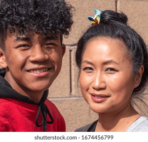 Asian Mother With Her African American Mixed Race Teenage Son.  Mixed Race Mother And Teenage Son.