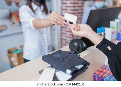 Asian Mother With Her Toddler Boy Shopping In The Baby Shop