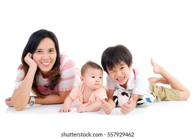 Asian mother and kids lying on the floor
