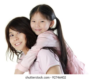 Asian Mother Piggyback Her Daughter, On White Background