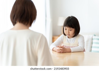 Asian Mother Scolding Her Daughter