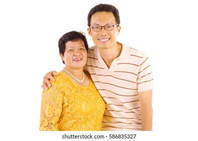 Asian mother and son. Happy Asian family mother and son having fun time at indoor studio.
