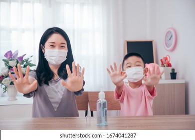 Asian Mother And Son Using Wash Hand Sanitizer Gel Pump Dispenser, Washing Hand With Alcohol Sanitizer, Protect The Virus And Bacterias.