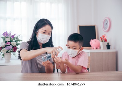 Asian Mother And Son Using Wash Hand Sanitizer Gel Pump Dispenser, Washing Hand With Alcohol Sanitizer, Protect The Virus And Bacterias.