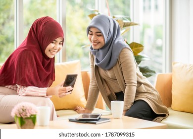 Asian Muslim Business Woman Using Smart Phone At Office For Social Media Or Online Shopping Or Internet Banking.portrait Of Happy Asian Woman With Hijab Using Digital Internet Communication Gadget