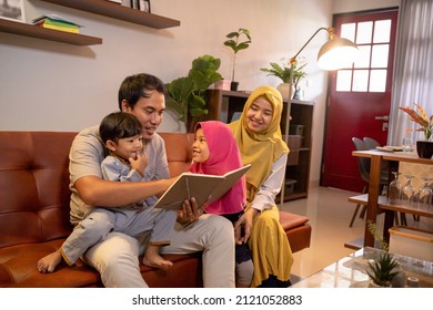 Asian Muslim Family Having Fun In Livingroom