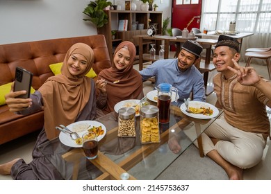 Asian Muslim Friend Take Selfie Together With Smartphone While Having Iftar Dinner