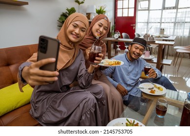 Asian Muslim Friend Take Selfie Together With Smartphone While Having Iftar Dinner