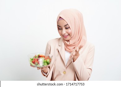 Asian Muslim Healthy Woman Eating Halal Clean Salad Food Isolated On White Background.Healthy Food. Vegan Salad. Diet. Dieting Concept. Healthy Lifestyle.