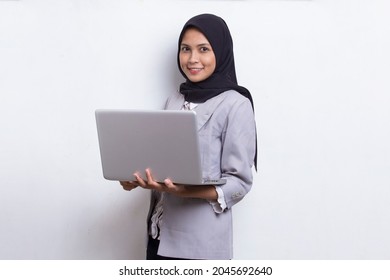 Asian Muslim Hijab Woman Using Her Laptop Computer Isolated On White Background
