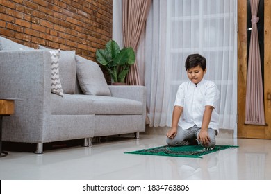 Asian Muslim Kid Praying Alone In The House Called Sholat