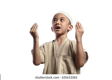 Asian Muslim Kid With White Cap Praying To God Isolated Over White Background