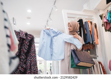 asian muslim woman shopping new clothes before eid mubarak