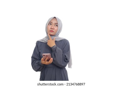 Asian Muslim Woman Thinking An Idea While Holding A Cellular Phone. Isolated On White