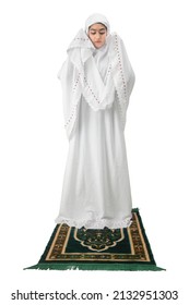 Asian Muslim Woman In Veil In Praying Position (salat) Isolated Over White Background