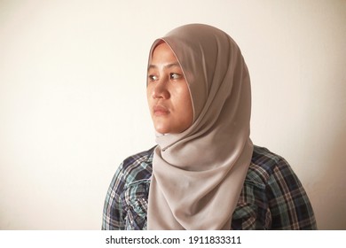 Asian Muslim Woman Wearing Hijab Looking To The Side With Neutral Expression, Diverse People Portrait Concept