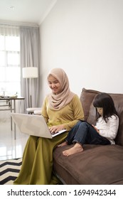 Asian Muslim Woman Working Remotely From Home