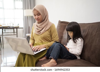 Asian Muslim Woman Working Remotely From Home