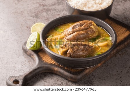Asian Mutton Nalli Nihari Its a dish for lamb Lovers Spicy and healthy and tasty closeup on the wooden board on the table. Horizontal
