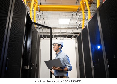  asian network engineer working in data center