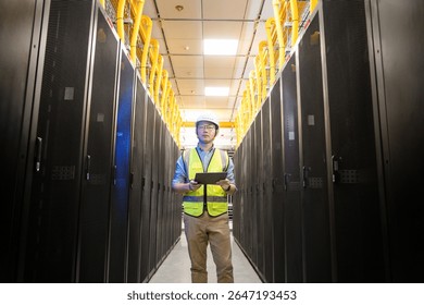 asian network engineer working in data center