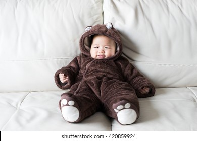 Asian Newborn Baby Wearing Bear Suit