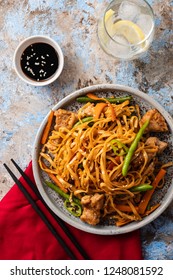 Asian noodles with pork in teriyaki sauce, with green beans, carrots and shiitake mushrooms. Top view. - Shutterstock ID 1248081592