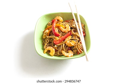 Asian Noodles With Seafood And Vegetables On White Background