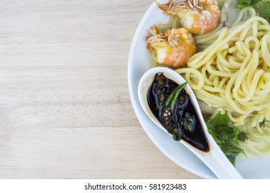 Asian noodles soup with shrimp and soy sauce.