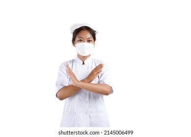 An Asian Nurse Gesturing No Using Her Hand. She Is Wearing Mask. Isolated On White Background.