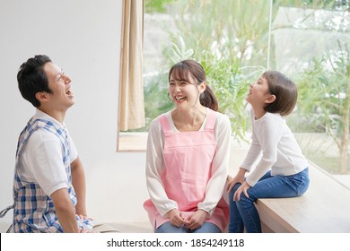 Asian Nursery School Teacher Talking With The Girl