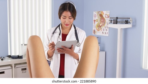 Asian OBGYN Examining Pregnant Patient