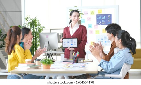 Asian Office, Asia Business People Meeting Team Brainstorming Strategy Plan For Small Business Startup, Woman Professional Leader Discuss With Coworker For Decision At Modern Co Working Space