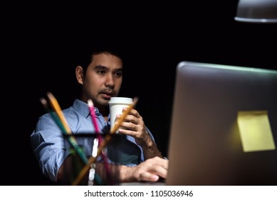 Asian Office Worker Feeling Sleepy And Having Fatigue From Hard Working In Front Of Computer At Night