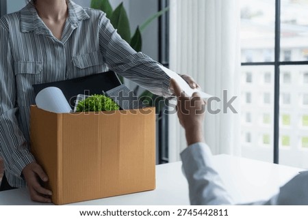 Asian office worker informs HR of resignation.