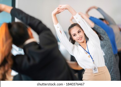 Asian Office Worker Relax And Stretching By Group Exercise Before Start Working Every Morning In Her Company