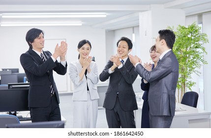 Asian Office Workers Clapping Their Hands