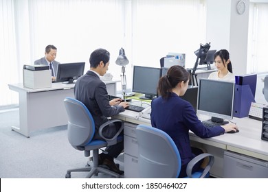 Asian Office Workers Working At The Office