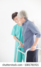 Asian Old Female Train Use Walker With Health Worker, Stroke Patient Use Walker, Walk Training, Rehabilitation Process 