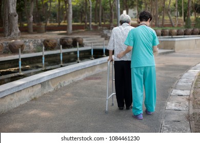 Asian Old Female Train Use Walker With Health Worker, Stroke Patient Use Walker, Walk Training, Rehabilitation Process 