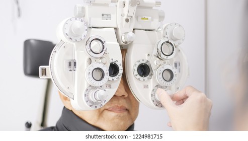 Asian Old Man Doing Eye Exam