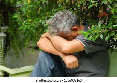 Asian Old Man Feeling Sad, Upset About Life, Depression. Uncontrolled Emotion, Crying, Negative Thought. He Is Father, Uncle, Grand Father In Family, Lose Job, Lose Money. Bad Moment In Life.