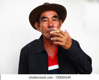 Asian Old Man Smoking With His Cigarette