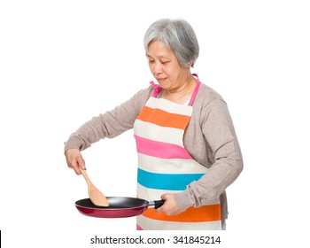 Asian Old Woman  Cooking With Frying Pan